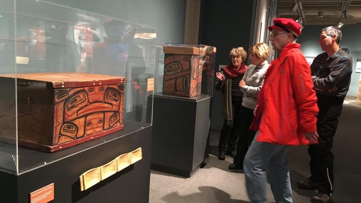 A volunteer docent leads a tour of the “People of the Sea and Cedar” exhibition at the Whatcom Museum’s Lightcatcher building.
