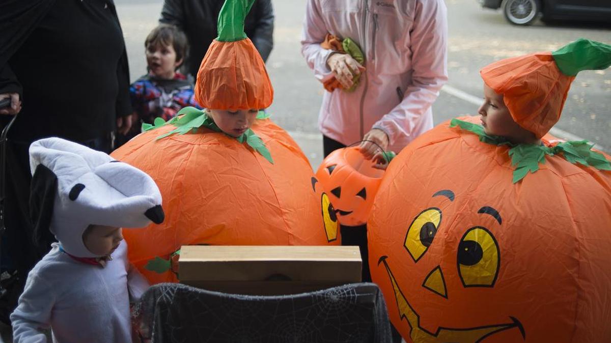 Trick-or-treaters gather in downtown Bellingham.