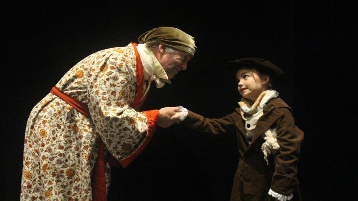 Jerry McGarity plays Scrooge and Dori DeGraaff plays Tiny Tim in “A Christmas Carol: The Musical” at Western Washington University.