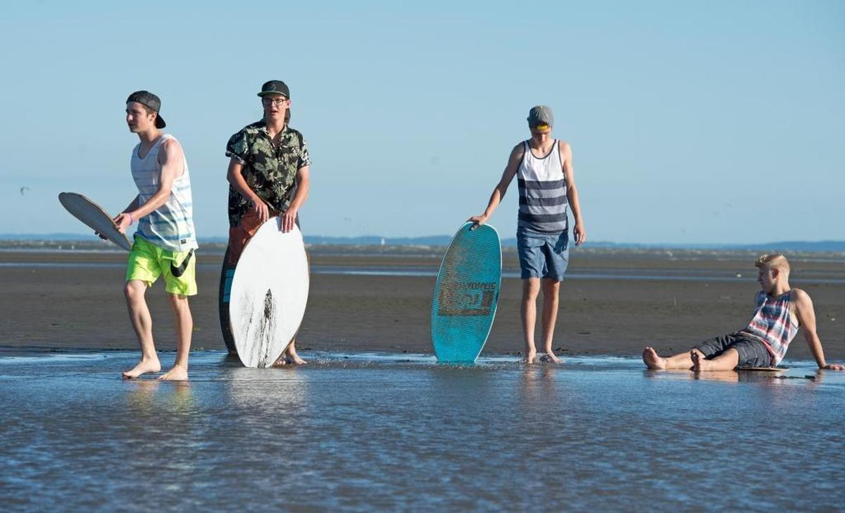 Skim boarders practice along Bellingham Bay during a low tide in 2014.