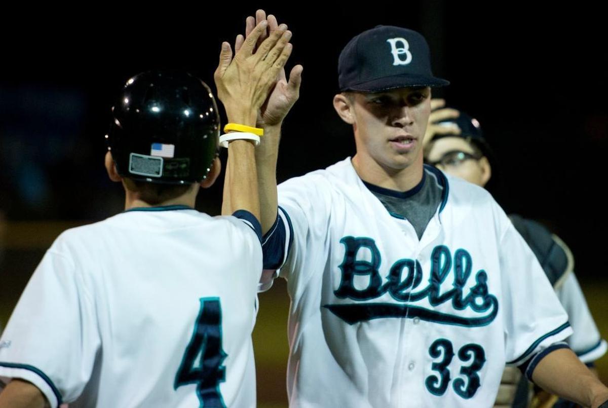 Members of the Bellingham Bells celebrate their victory over the Corvallis Knights in the West Coast League Championship in 2014 at Joe Martin Field.