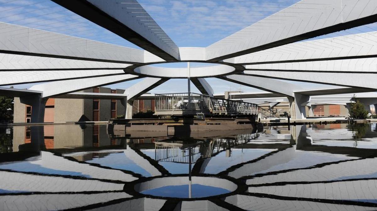 The arches of the secondary clarifier are reflected in wastewater being treated at the Post Point Wastewater Treatment plant in Bellingham, Wash., in 2010.