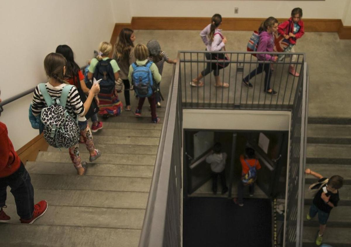 Students in first through fifth grades walk down the stairs of Western Washington University’s SMATE Hall for a Kids Night Out @ Western event. The next session is Friday, Jan. 20.