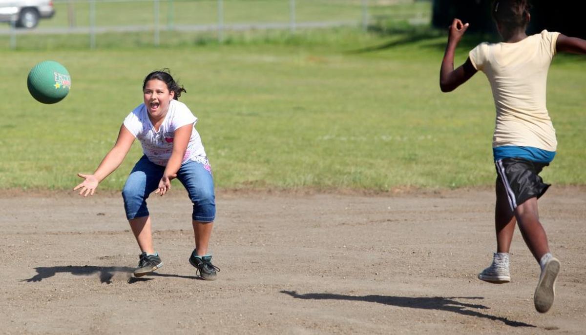Children play kickball at Kendall Elementary School in 2009.