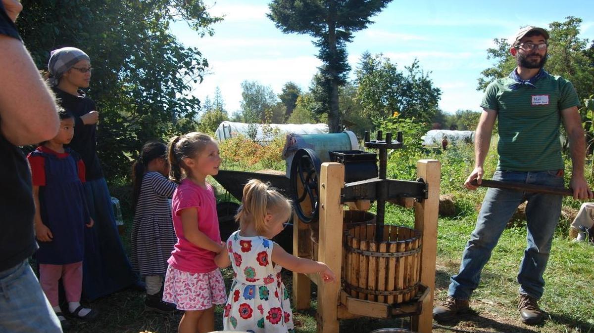 
Visitors watch a hand-cranked cider press at Inspiration Farm in September 2014. The 2015 Whatcom County Farm Tour is Sept. 12.
