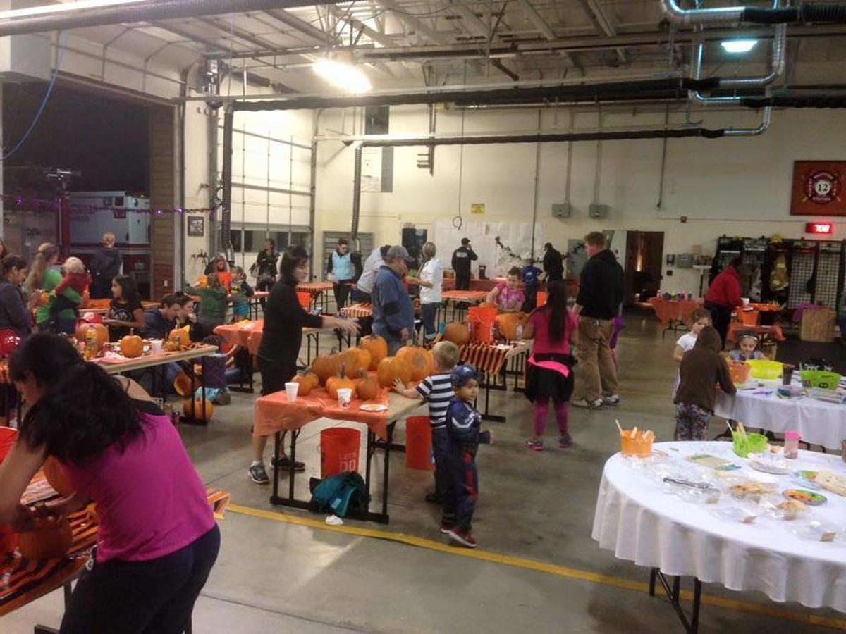 Participants carve jack-o-lanterns at North Whatcom Fire & Rescue Station 12 in 2015.