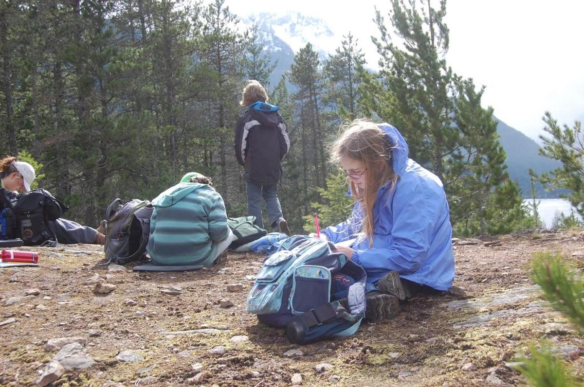 Mountain School students rest atop a knoll overlooking Diablo Lake at the North Cascades Learning Center in 2009.