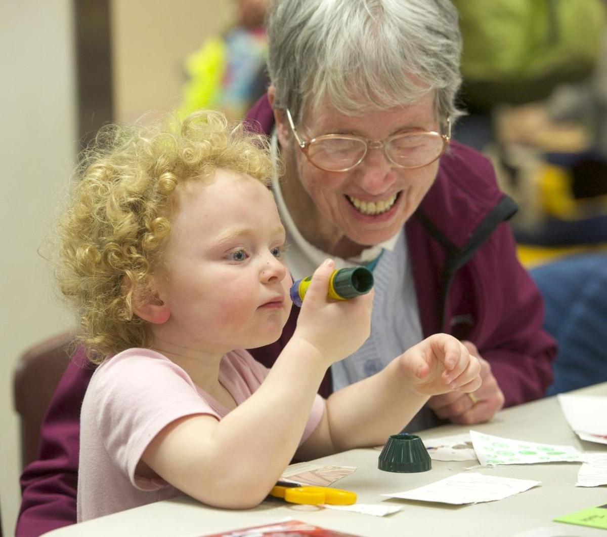 Mia Grace Albert, left, and her grandmother Penny Cowan work on a craft together at the Bellingham Public Library during a program in 2015. The “Make It @ Your Library: Corner Bookmarks” is for all ages from 4-5:30 p.m. Thursday, Sept. 1, at the Bellingham Public Library,