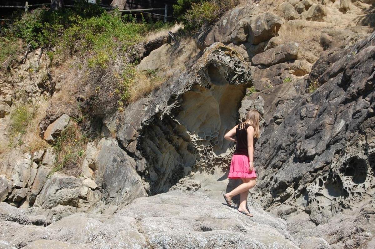 A child explores the sand formations at Larrabee State Park during a low tide in summer 2009.