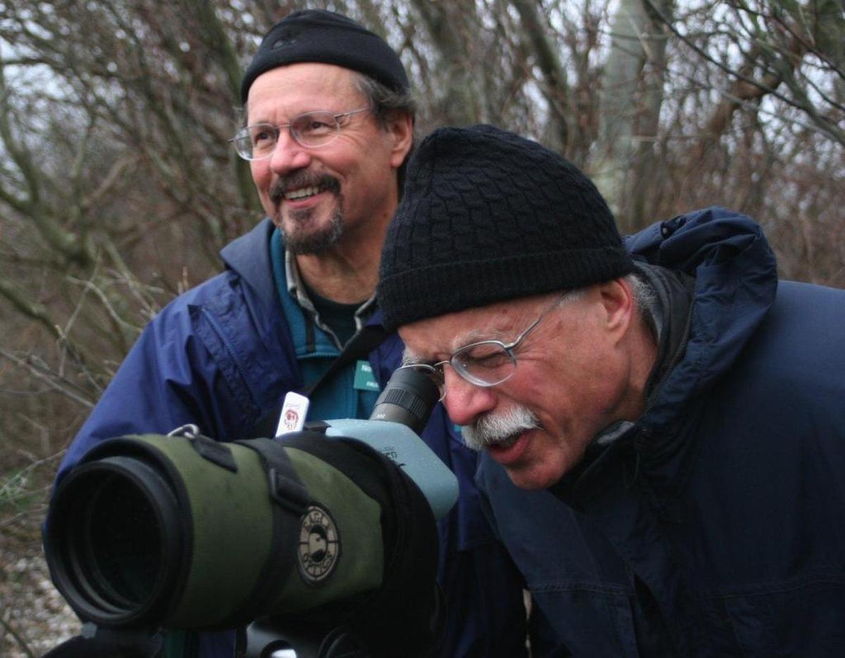 Paul Woodcock, left, shows Jerry Stege where to point his scope during an undated outing to Semiahmoo spit.