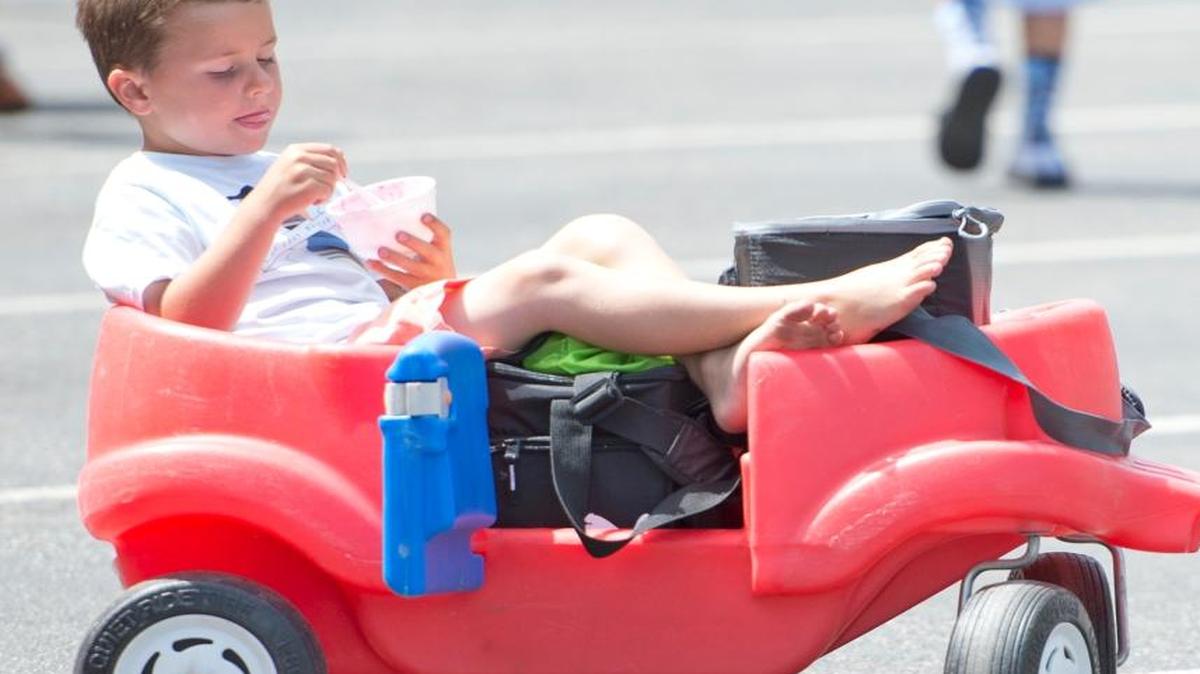 Brady Schneider enjoys ice cream and raspberries in a wagon at the Northwest Raspberry Festival in 2014 in downtown Lynden. The 2017 festival is Friday and Saturday.