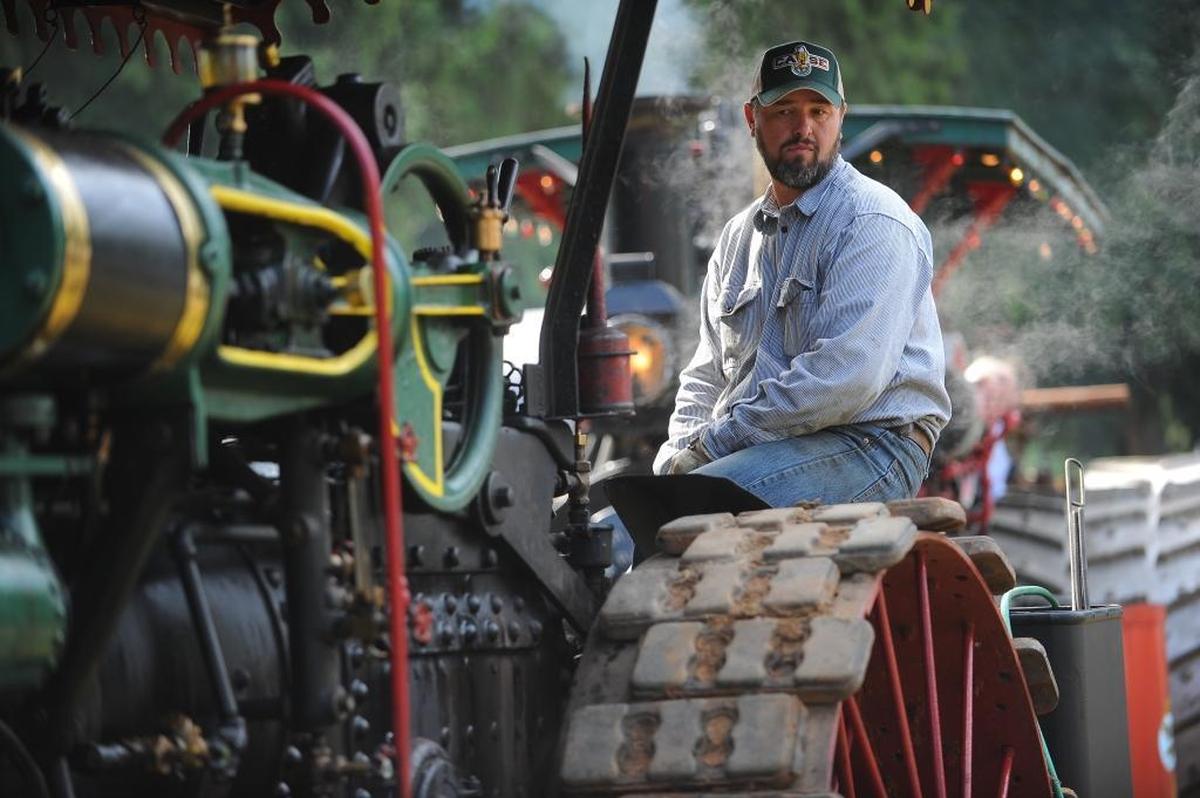 Nels Lagerlund of Burlington sits on his 1914 Case steam tractor during the annual Puget Sound Antique Tractor and Machinery Association’s Threshing Bee at Berthusen Park in 2014.