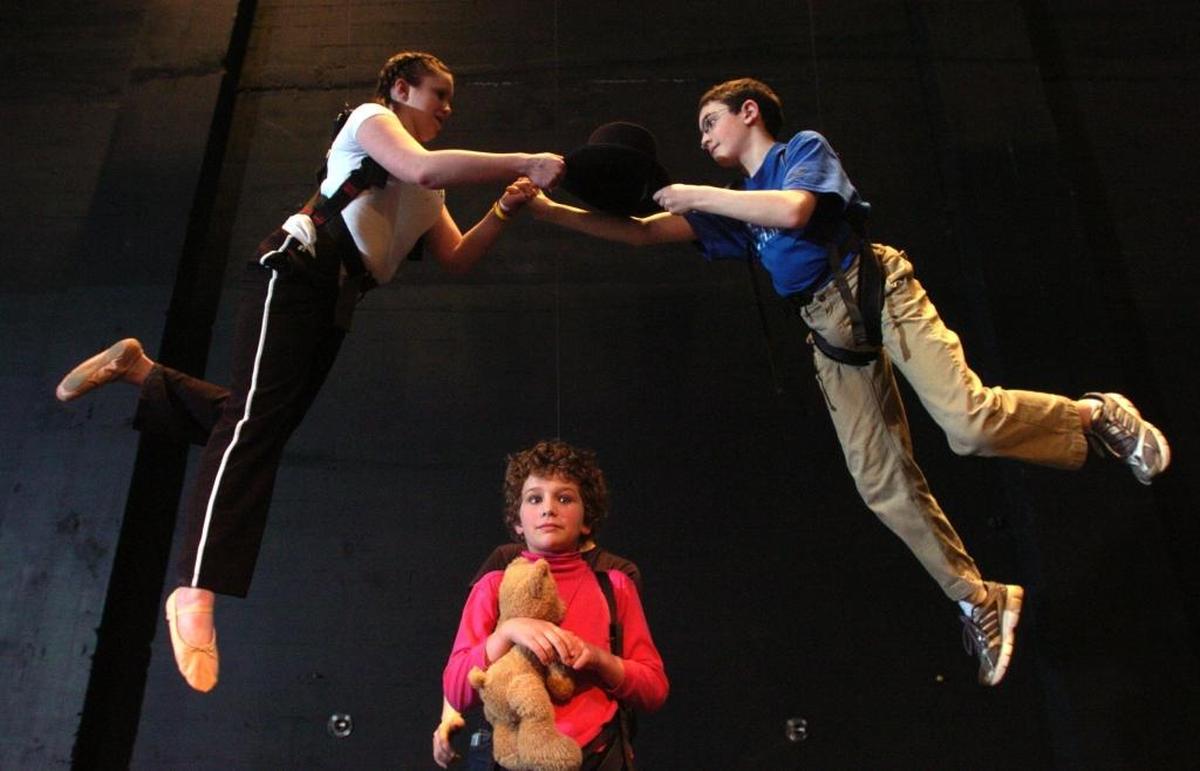 Bellingham Arts Academy for Youth performers practice with a harness system at the Mount Baker Theatre for a production of “Peter Pan” in 2008.