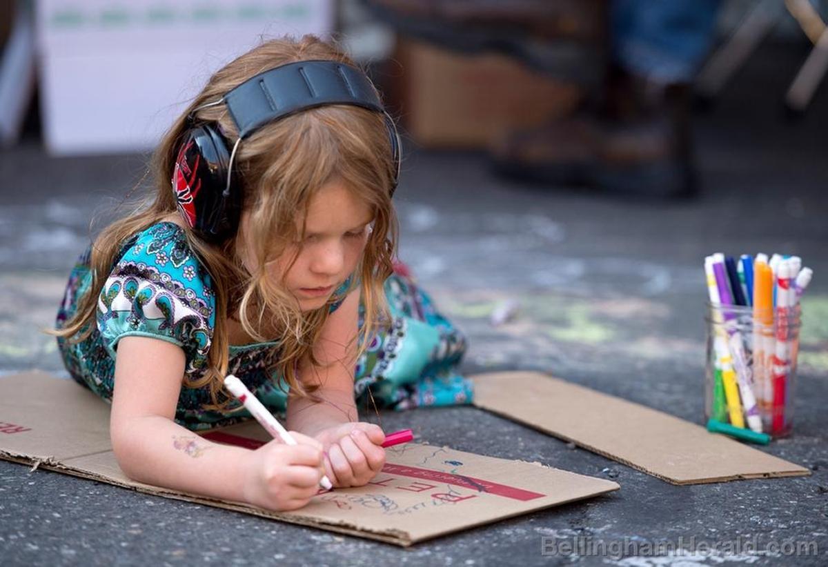 A child decorates cardboard in the Play Lab at Downtown Sounds in 2014.