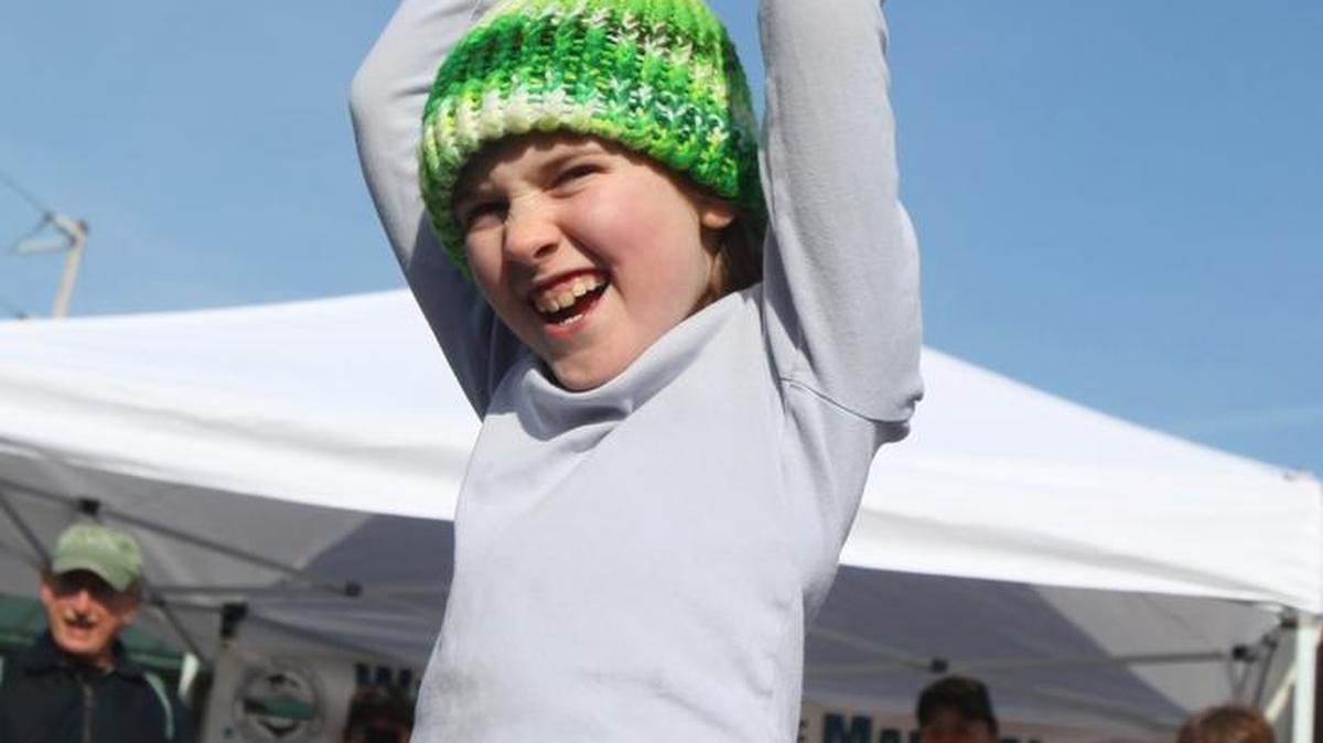 Isabella Yoho caught the cabbage on the opening day of the Bellingham Farmer’s Market in 2009.