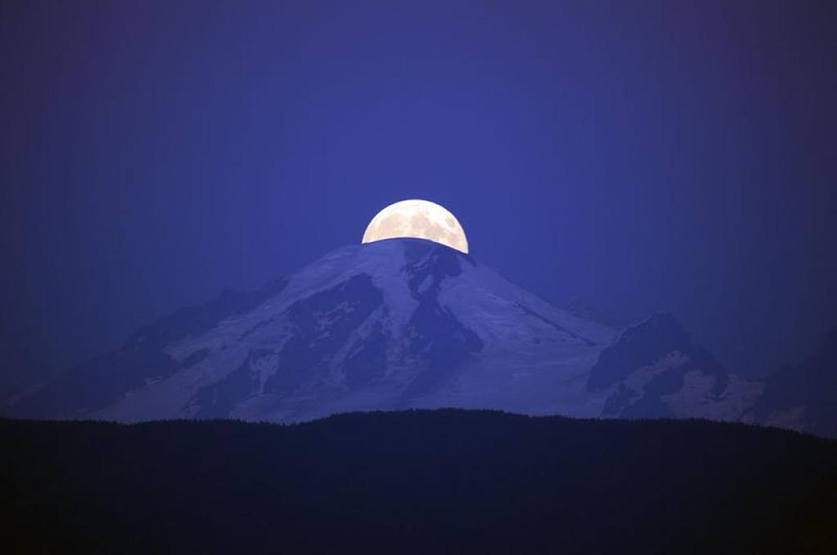 A moonrise over Mount Baker.