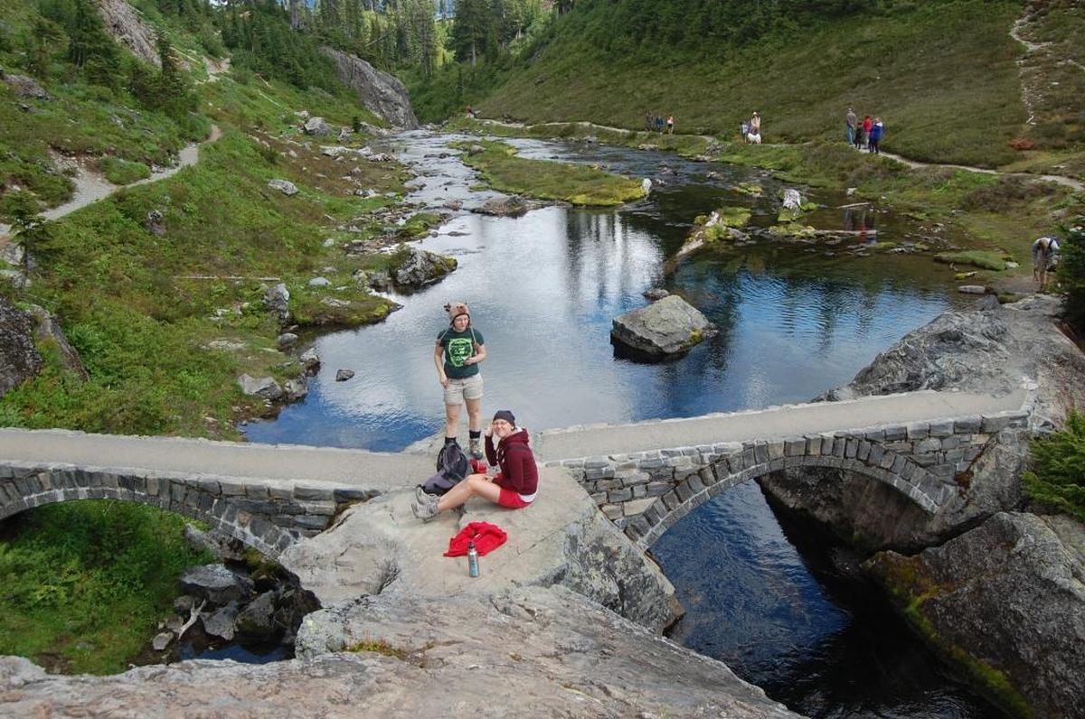 Hikers are shown on a trail below Heather Meadows visitor center in 2012.