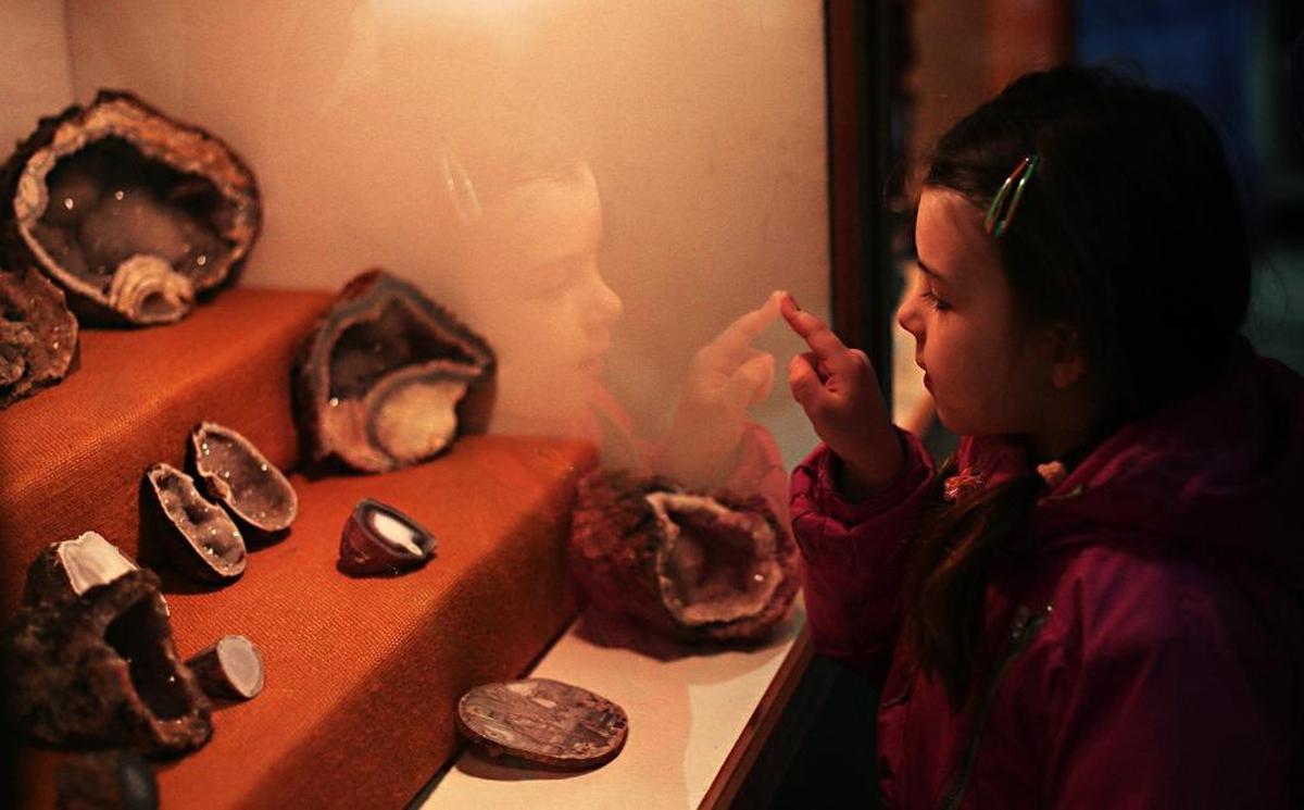 A young visitor gazes at a rock and crystal display during the Mount Baker Rock and Gem Club’s 50th annual show in 2011.