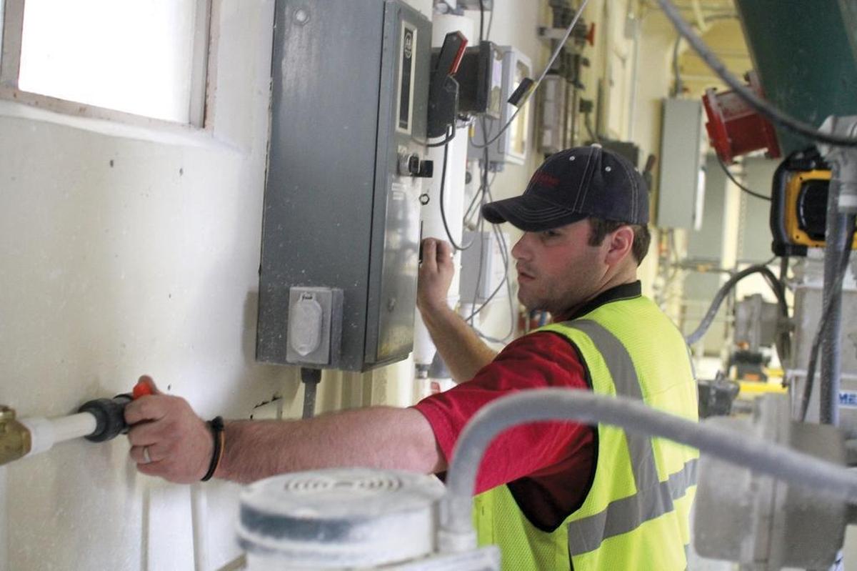 Electrician James Jones works at the old Lynden drinking water treatment plant in 2011.