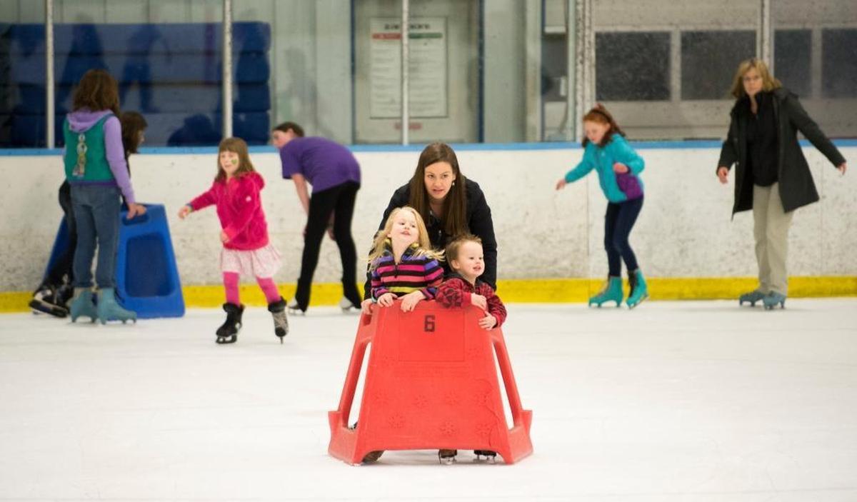 Emma Bodin and her children Adalynn and Bradley ice skate at the Bham Fam Fair in March 2015.