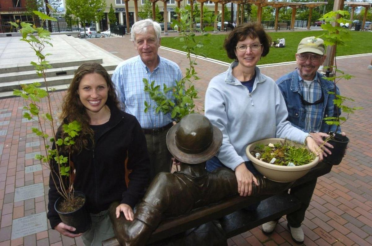 Members of the Komo Kulshan Chapter of the Washington Native Plant Society pose with items for the Native Flora Fair and Backyard Habitat Tour at the Fairhaven Village Green in this undated photo.