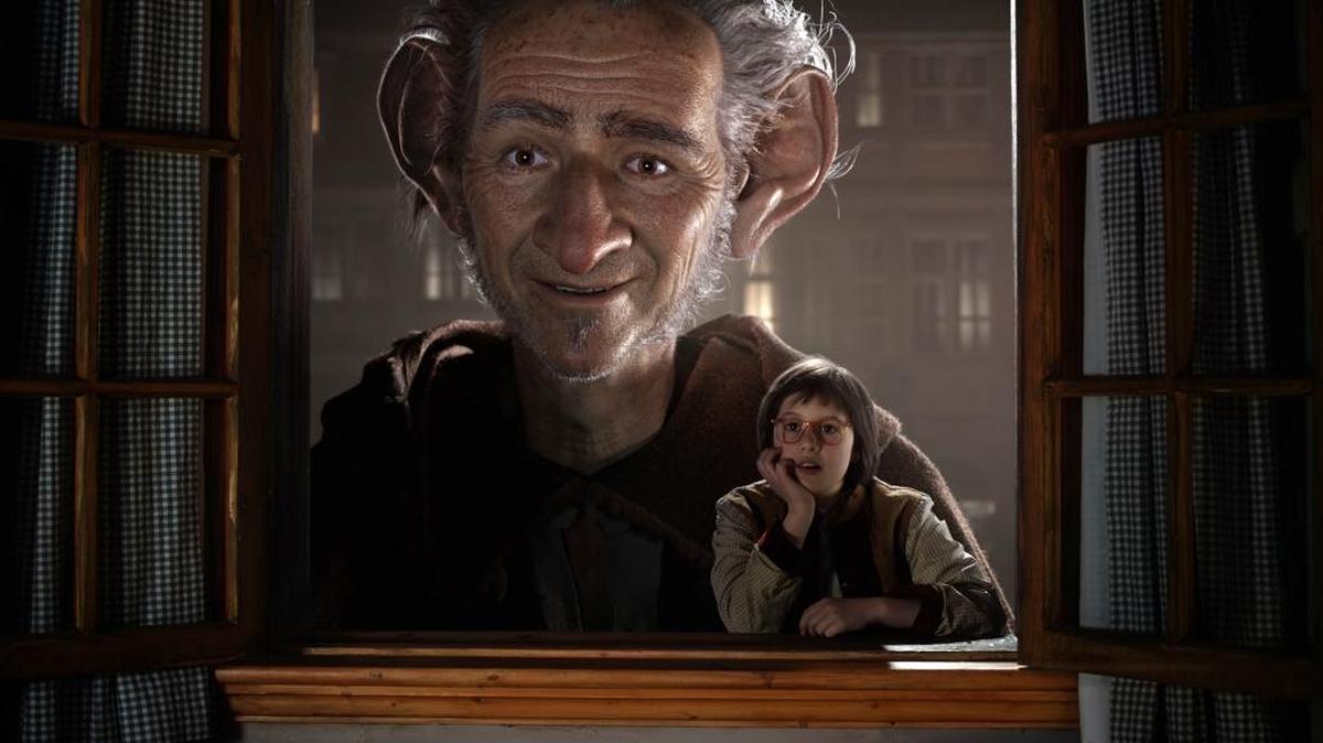 Ruby Barnhill, right, and the Big Friendly Giant from Giant Country, voiced by Mark Rylance, are picture in a scene from “The BFG.”