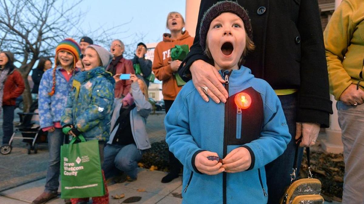 Etienne Thumlert, then 6, yells “Ho Ho Ho!” as he and others help turn on the lights at the 2013 Whatcom Museum’s Deck the (Old City) Hall lighting celebration. The 2015 event begins on Nov. 27.