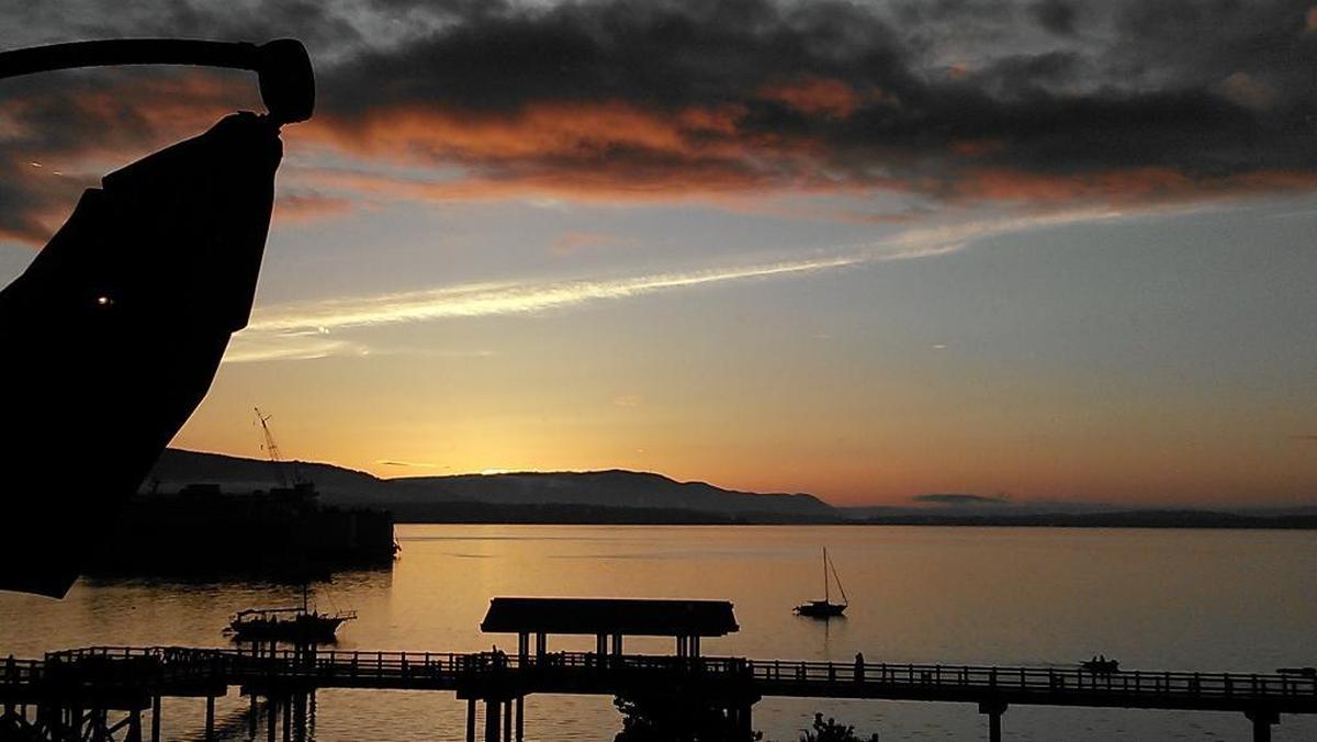 View of the sunset and Bellingham Bay on Wednesday, Oct. 21, from the bar in Keenan’s at the Pier in Bellingham.