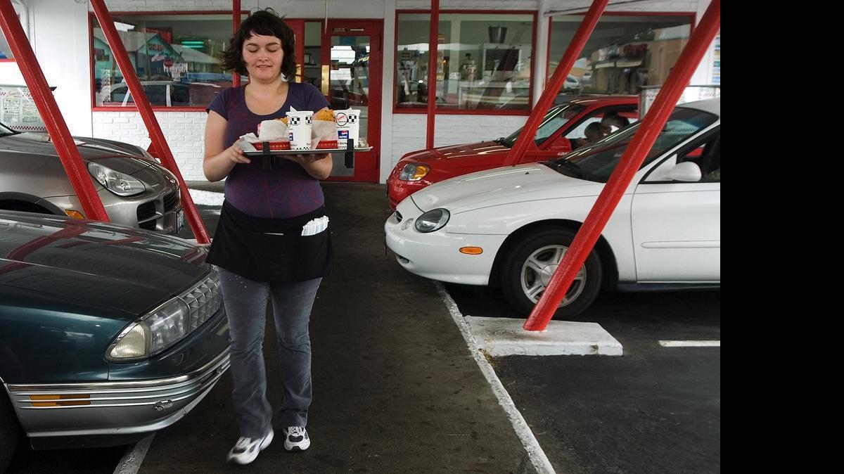 
Boomers, a retro-1950s burger joint, is known for its thick shakes and crunchy waffle fries as well as car hops.
