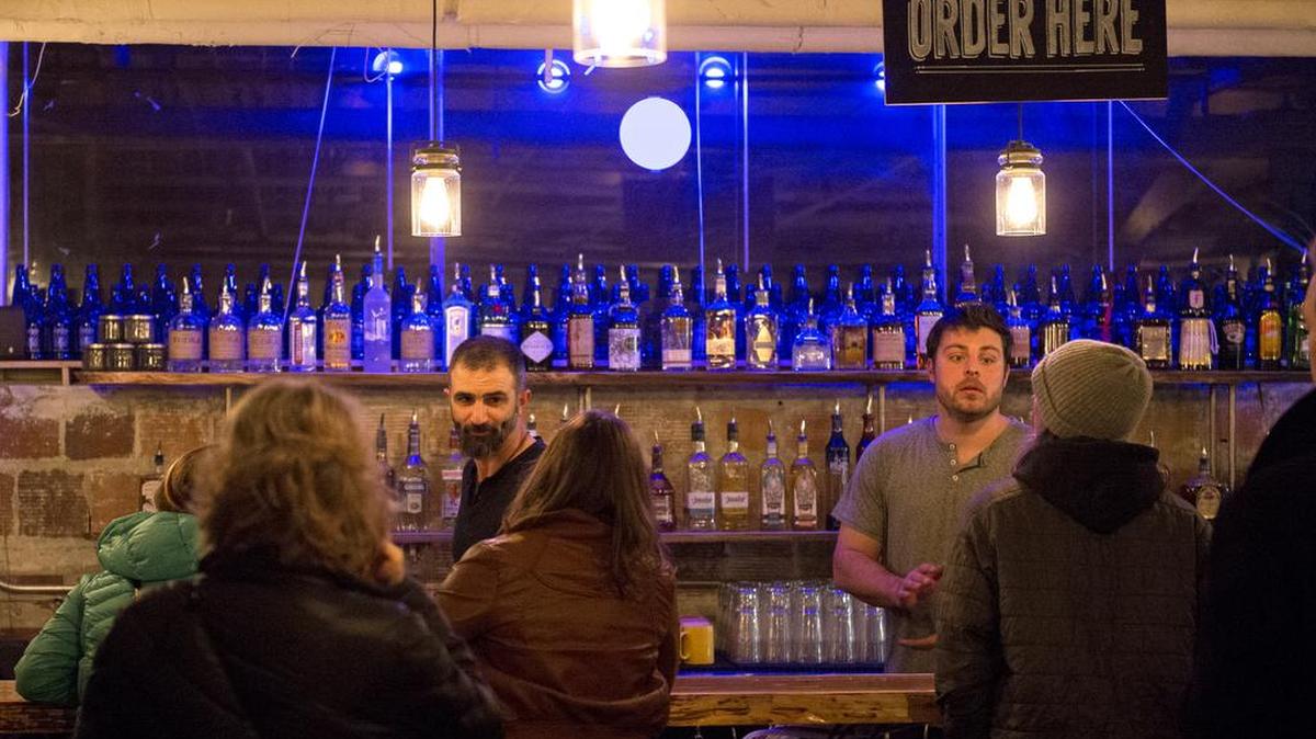Larry Rupcicha, left, and Patrick Mullen serve customers on the opening night of Culture Cafe at Kombucha Town on Thursday, Jan. 7, in Bellingham, Wash. 
