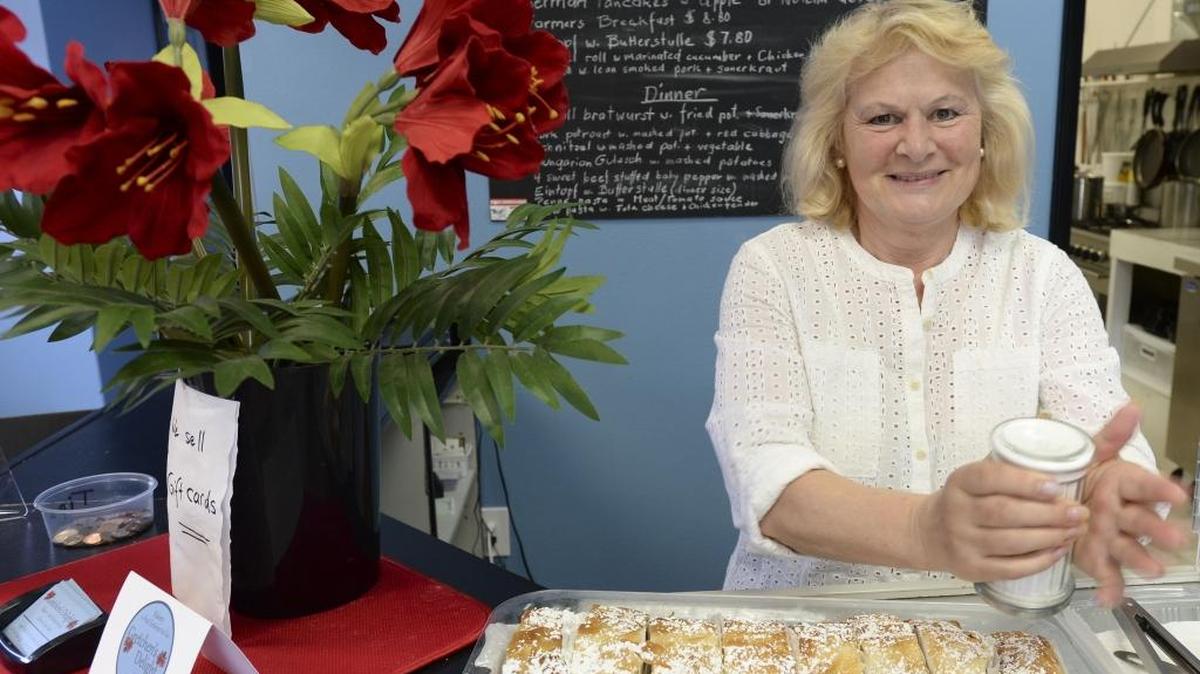 Owner Liesa Scott shakes powdered sugar on apple strudel at Gretchen's Delight, her Lynden restaurant, April 21 on Front Street next to the Little Red Wagon children's clothing store. The restaurant specializes in German, Austrian and Hungarian food.