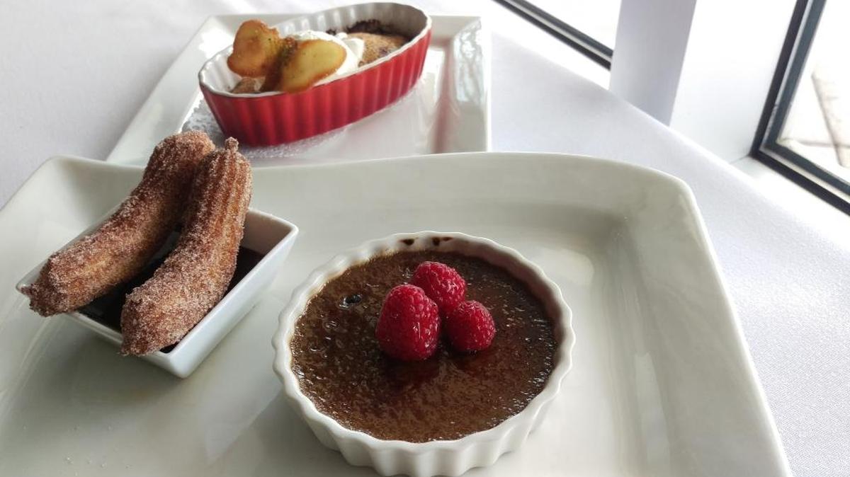 Desserts from Café Culinaire at Bellingham Technical College. Clockwise from bottom, creme brulee made with Tony’s Coffee, churros with dark-chocolate sauce, and blueberry financier with Meyer lemon ice cream.