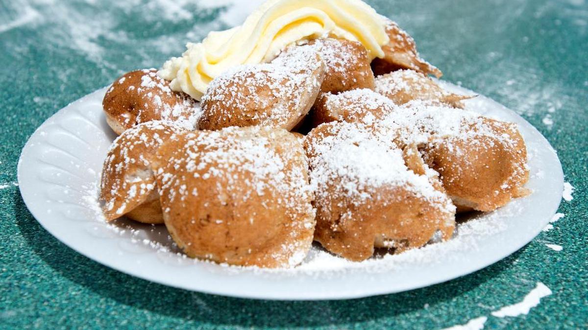 
Poffertjes are a Dutch pastry, a cross between a pancake and a doughnut hole.
