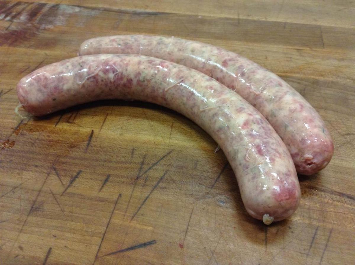 Butchers at Carne The Butcher shop make their own bratwurst, another grilling favorite.
