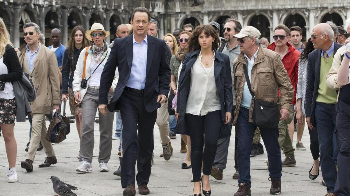 Langdon (Tom Hanks) and Sienna (Felicity Jones) make their way through Piazza San Marco in Venice in “Inferno,” directed by Ron Howard.