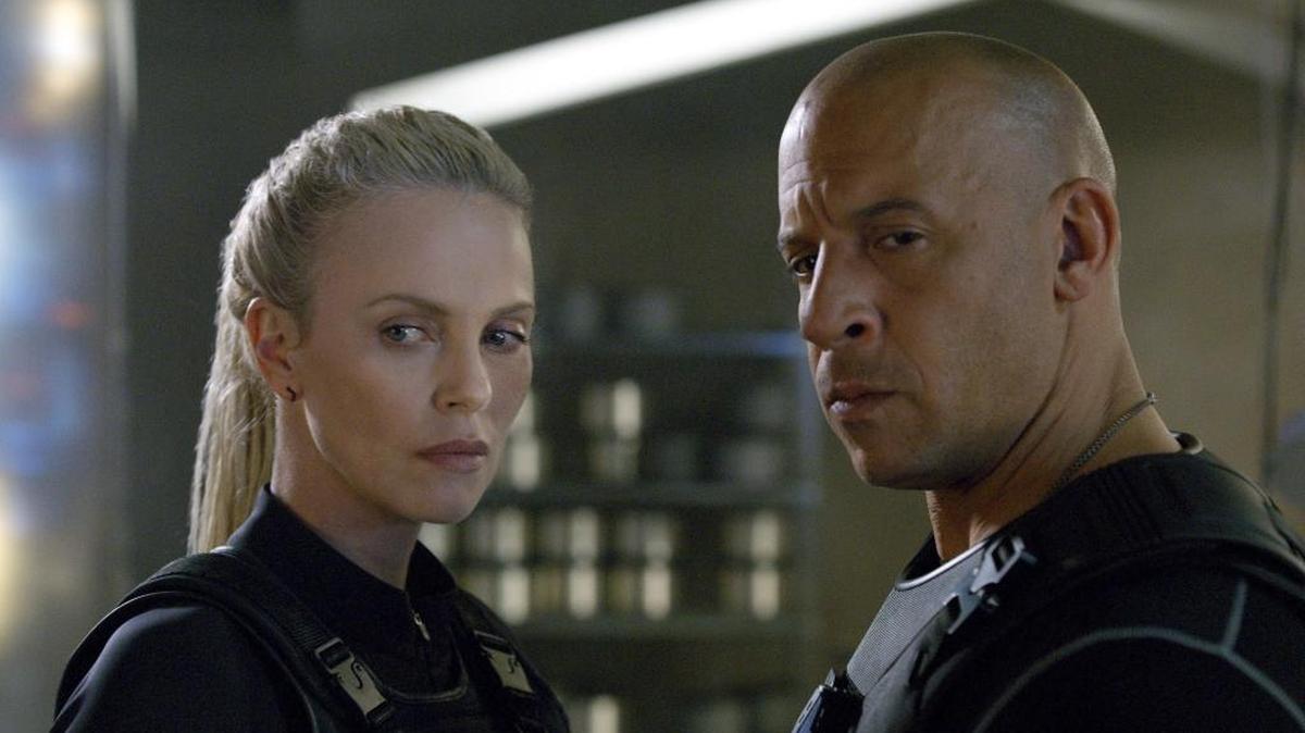 This image released by Universal Studios shows Charlize Theron, left, and Vin Diesel in a scene from "The Fate of the Furious," expected in theaters on April 14. (Universal Studios via AP)