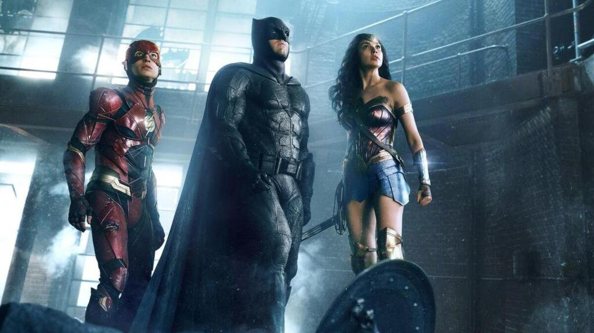 Ezra Miller as The Flash, Ben Affleck as Batman and Gal Gadot as Wonder Woman in the film “Justice League.”