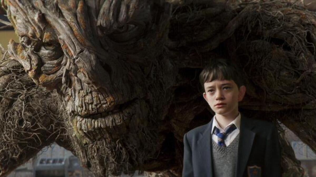 Lewis MacDougall appears with the Monster, voiced by Liam Neeson, in “A Monster Calls.”