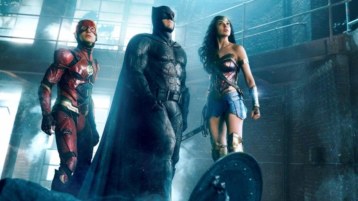 Ezra Miller as the Flash, left, Ben Affleck as Batman and Gal Gadot as Wonder Woman in “Justice League.”