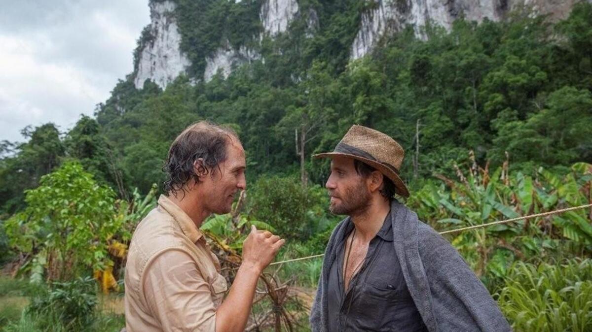 Matthew McConaughey, left, plays a 1980s gold prospector who follows a dream about a tropical valley full of the stuff and Edgar Ramirez plays his partner in “Gold.”