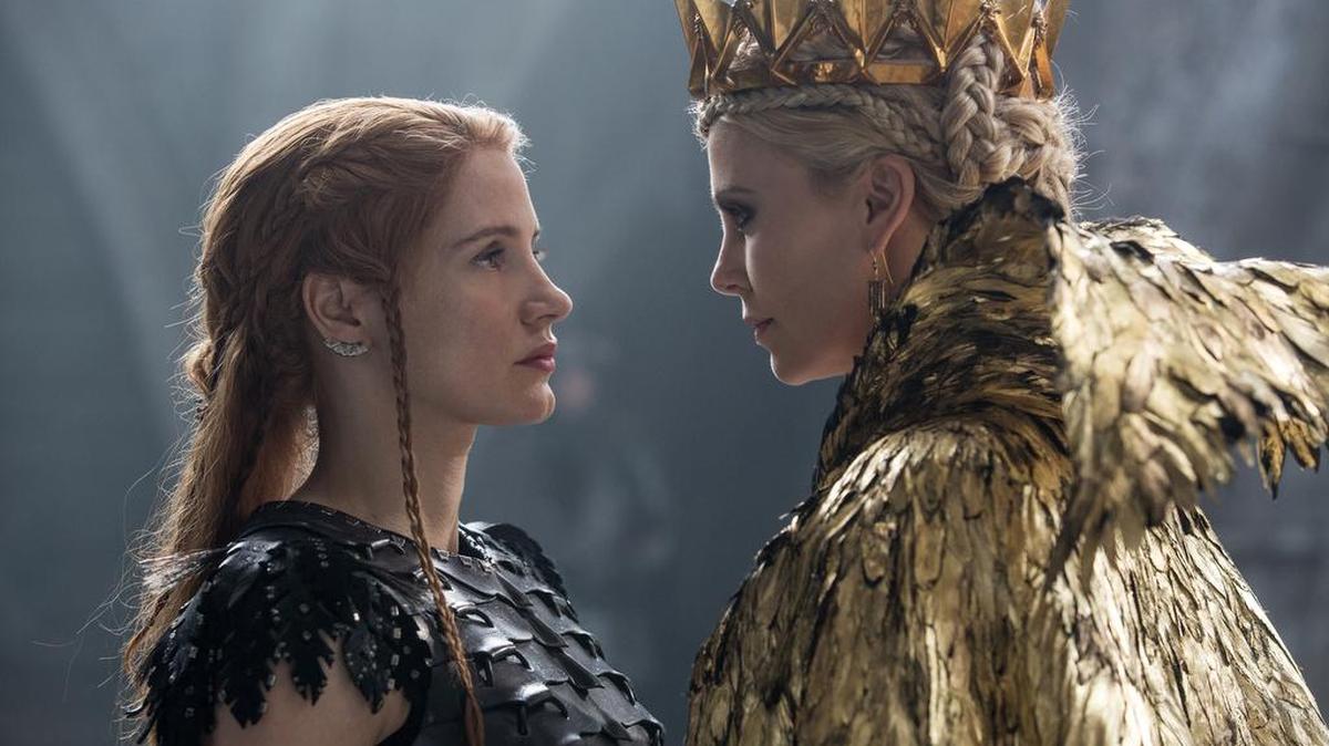 Jessica Chastain, left, and Charlize Theron appear in a scene from “Huntsman: Winter’s War.”