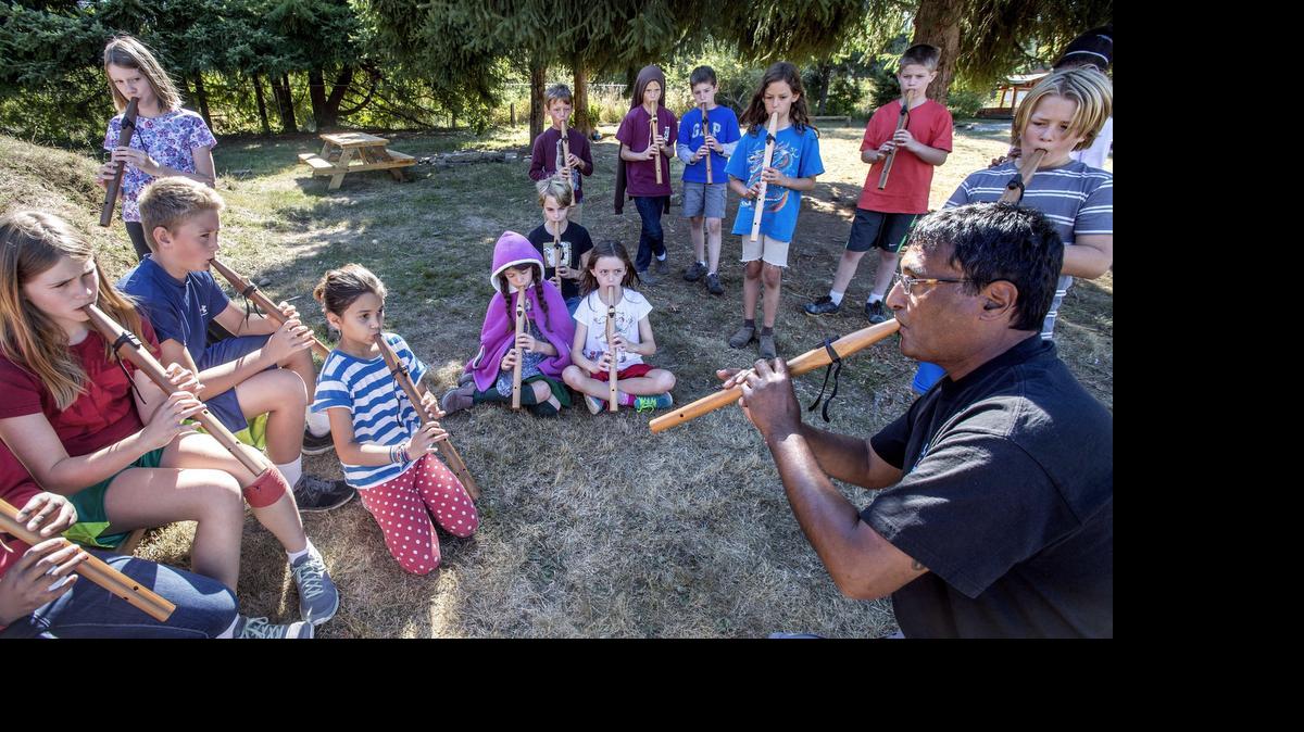 
Peter Ali, right, a flute instructor at the Northwest Indian College on the Lummi reservation, improvises a song with students on their Plains Indian-style flutes at the Olympia Waldorf School in 2014.
