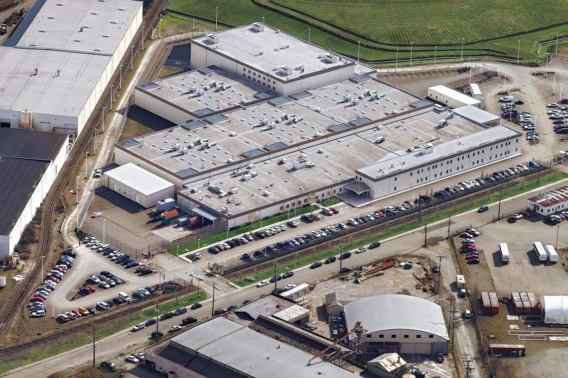 The Northwest Detention Center, a privately owned and operated immigration detention center, was built on the Tacoma Tideflats to replace a similar facility in Seattle. Opening in 2004 with a 500-bed capacity, the NWDC has since expanded capacity three times into a facility with 1,575 beds, making it one of the largest immigration detention centers in the U.S. Aerial photo taken in Spring 2012.
