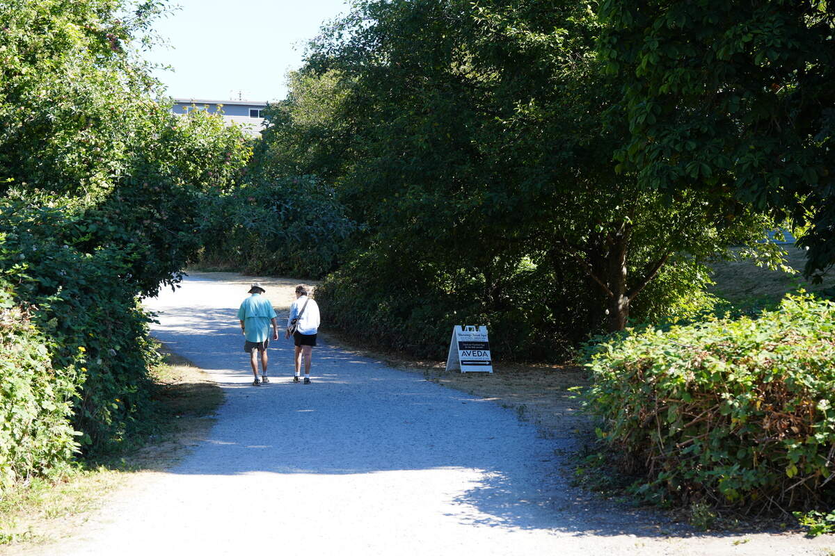 People walk along the South Bay Trail in Bellingham’s Fairhaven neighborhood this month.
