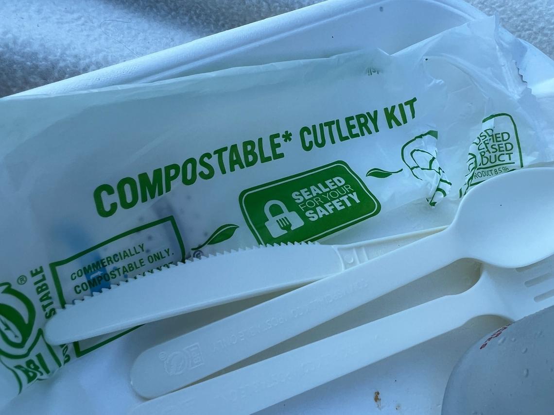 A package containing a fork, knife and spoon made of compostable material, and packaged in a compostable wrapper, are given to customers when they ask for eating utensils at Captain’s Cod, a food truck serving fish and chips on Thursday, July 28, in Bellingham.