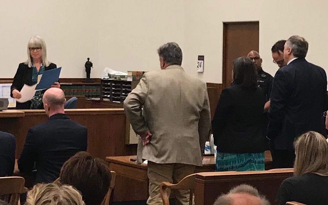 Defendant Timothy Bass, far right, listens as court clerk Connie Long, left, reads the jury’s verdict in his trial for first-degree murder Friday in Whatcom County Superior Court. Bass was found guilty of the 1989 abduction, rape and murder of Amanda “Mandy” Stavik.