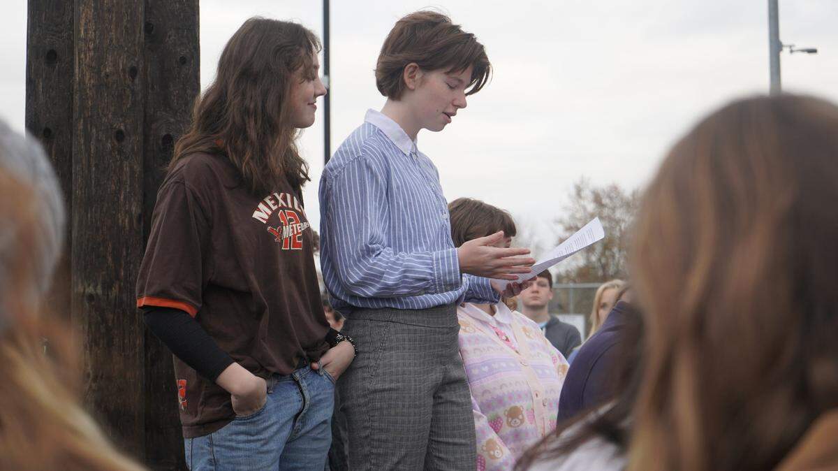 Students Abby Brandon and Elliot Peterson read a statement to a crowd during a walkout protesting school threats and gun violence at Sehome High School on Wednesday, Nov. 23, in Bellingham.