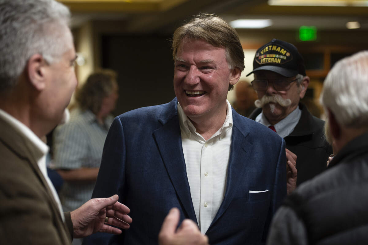Whatcom County executive candidate Tony Larson reacts as port commissioner Ken Bell, left, tells a story during Larson’s election night party at the Bellingham Golf and Country Club in Bellingham, Wash., Tuesday, Nov. 5, 2019.