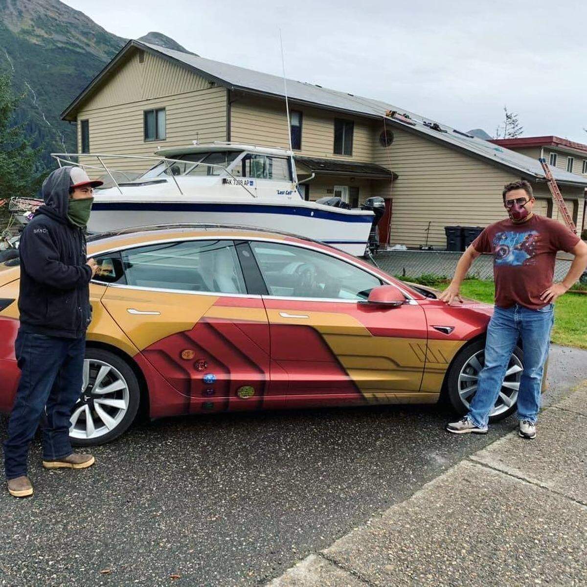 Idaho resident Len Anderson, right, poses with his Ironman-themed End Game Tesla on Douglas Island, Alaska, on Tuesday, Sept. 22. Anderson is attempting to travel to all 50 state capitals during the cornavirus pandemic.