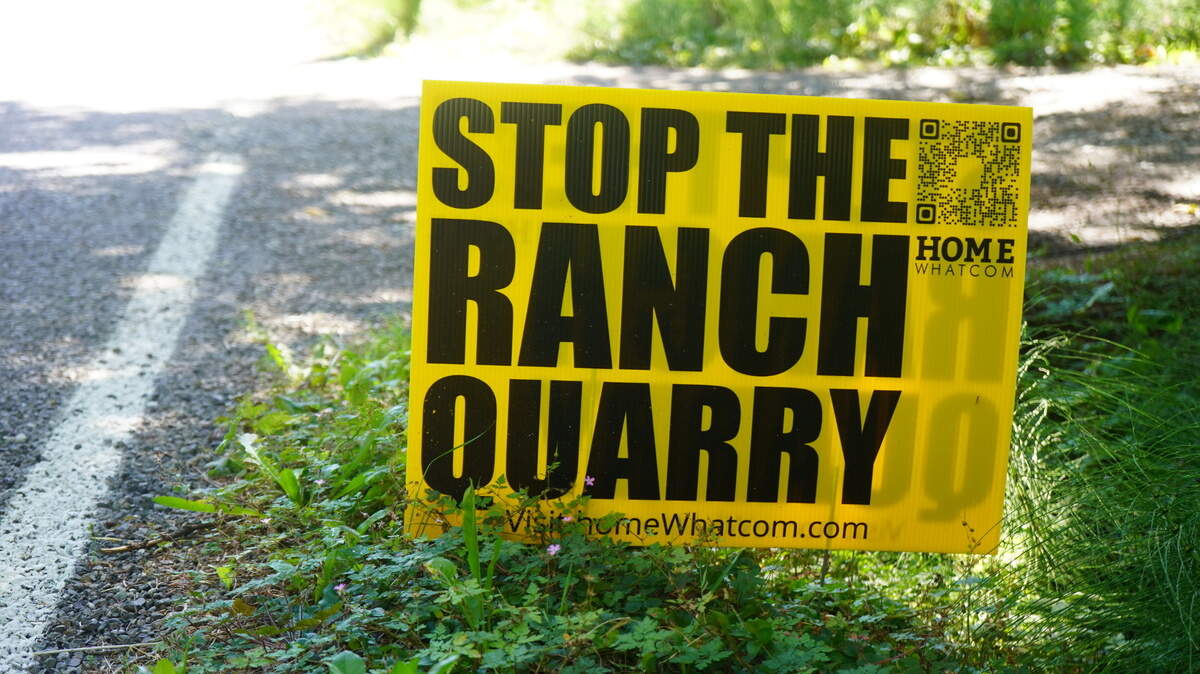 A sign opposing the proposed 64-acre open pit rock quarry is posted on the property of Andrew Clarke on September 1, 2023, in Whatcom County, Wash. Clarke’s house sits about 100 feet away from a road that could be used to truck the extracted gravel.                               